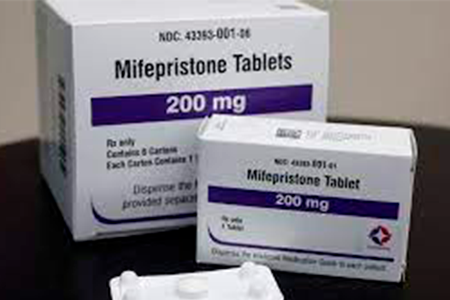 Depicted is a box of Mifepristone 200 mg tablets, with the design and labeling intended for the healthcare system in Guinea.
